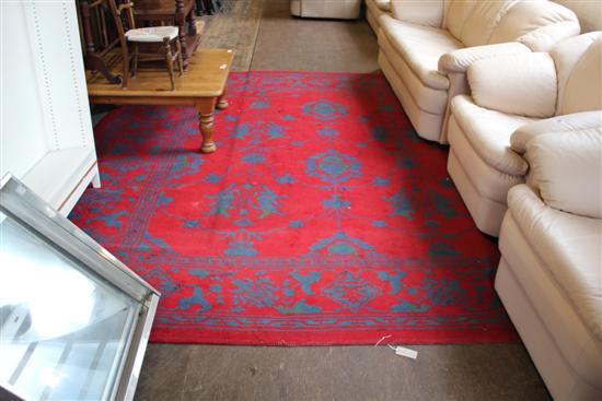 Turkey carpet, all-over dark blue floral & foliate design on red ground, 124in x 114in